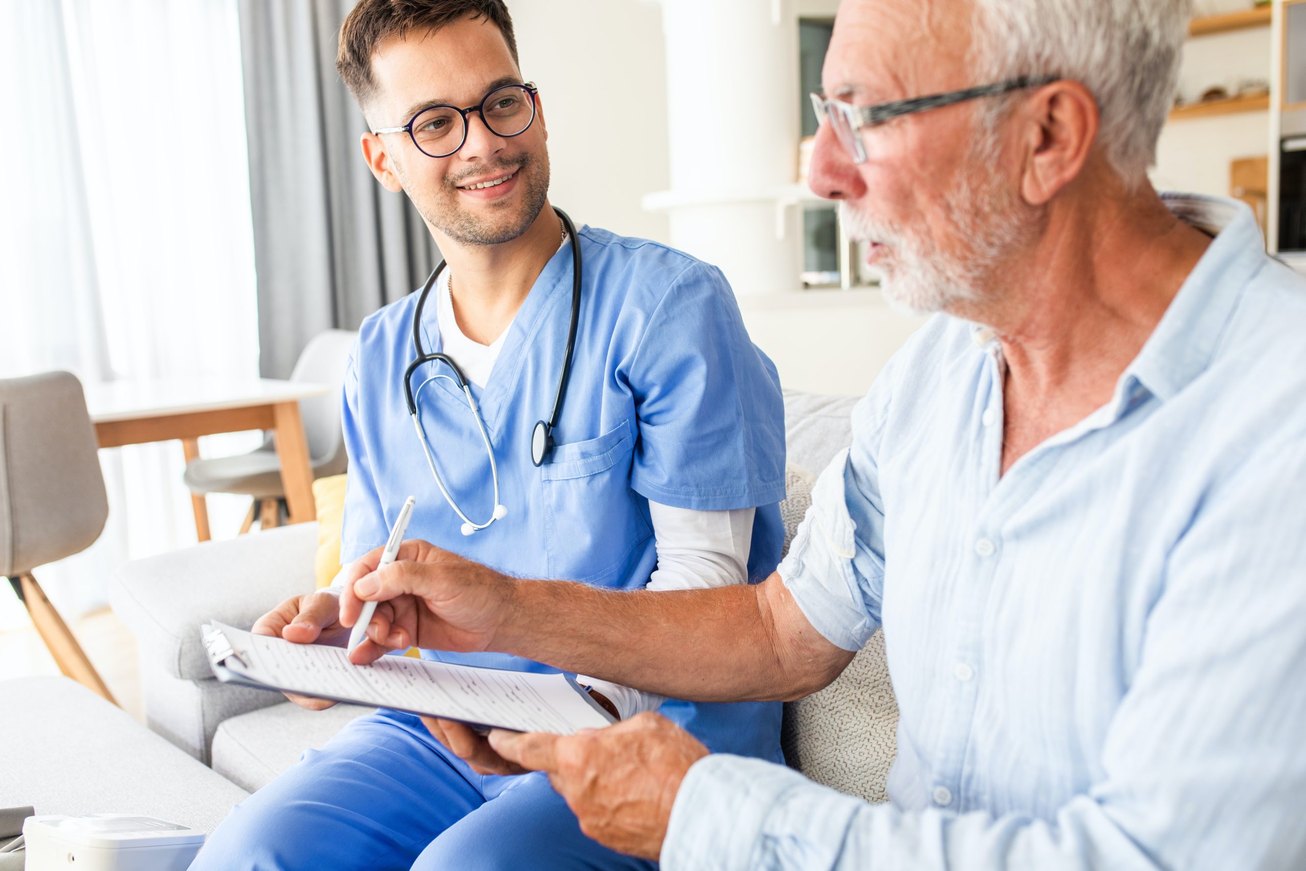 medical professional speaking with older man