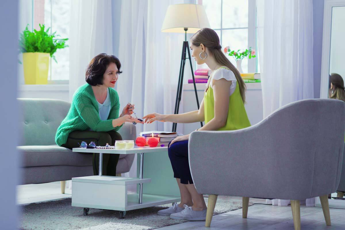 young woman speaking with therapist