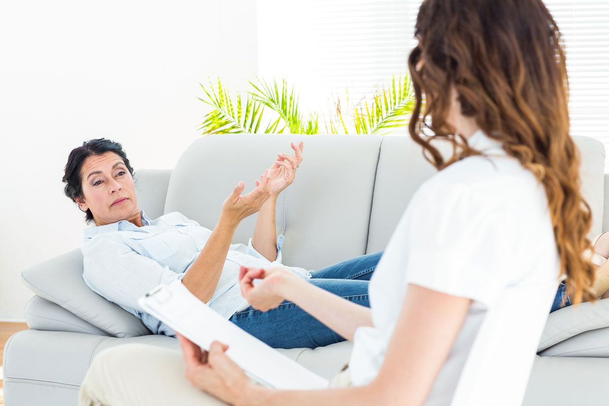 woman speaking with a therapist